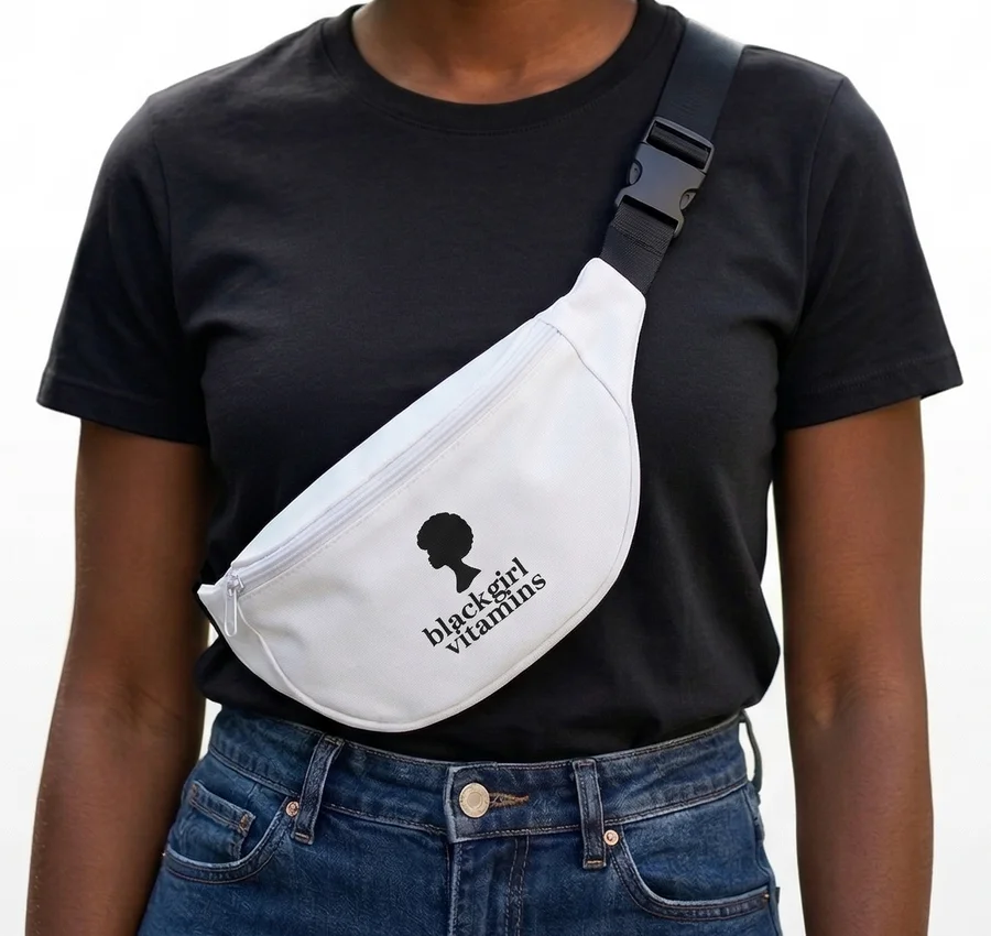 A woman in a black tee wearing the white BGV Fanny Pack across her chest